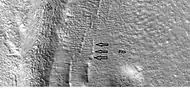 Close-up showing cracks containing pits on the floor of a crater, as seen by HiRISE under HiWish program.  Cracks may start as a line of pits that enlarge, then join.  Location is the Casius quadrangle.