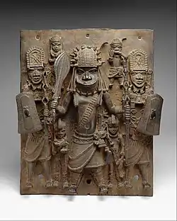 Plaque with warriors and attendants; by Edo people; 16th-17th century (Nigeria); brass; height: 47.6&nbsp;cm; Metropolitan Museum of Art