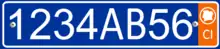 Plate with a single row of white alphanumeric characters on a blue background, and an orange bar on the right side containing the white letters CI at the bottom, and a white silhouette of the Ivory Coast inside a white circle at the top.