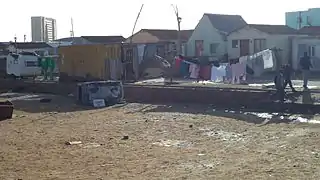 the same football field with an overturned latrine in the field