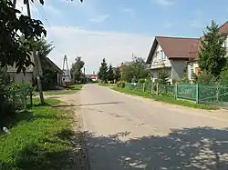 Houses by the unpaved road in Sanniki