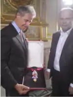The recreated great Golden Fleece of King Louis XV of France, presented by H. Horovitz (left) and François Farges&nbsp;[fr] (right) at the Hôtel de la Marine, formerly the royal Storehouse in Paris, on June 30, 2010