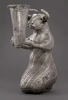Kneeling Bull with Vessel. Kneeling bull holding a spouted vessel, Proto-Elamite period (3100-2900 BC). Metropolitan Museum of Art