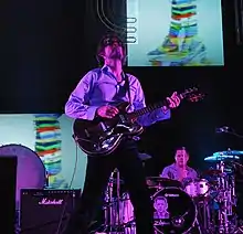 Jarvis Cocker performing with Pulpat the Coachella Festival in 2012.