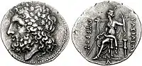 Pyrrhos, King of Epeiros, 297–72 BC. Head of Zeus in wreath of oak / Demeter seated, holding long sceptre and her veil; caption ΒΑΣΙΛΕΩΣ ΠΥΡΡΟΥ (of king Pyrrhus).