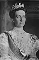 Victoria of Baden wears the fringe tiara as a corsage; she also wears the Leuchtenberg tiara.
