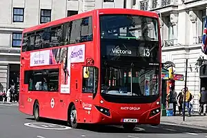 A red London Transit double-decker bus near Marble Arch, displaying route 13 to Victoria
