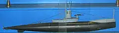 The world's first hunter-killers, the British R-class submarine of 1918 was a drastic return to the concept of the high-speed undersea warship. Made to hunt enemy submarines, they featured extensive streamlining, a virtually nonexistent casing, and the ability to make 14&nbsp;kn (26&nbsp;km/h) for a full hour. Only the knife-like bow shape betrays the expectation of the designer that these boats would not operate continuously submerged, only breaking the surface to charge their batteries. They were instead to transit slowly on the surface using their diesel engine, only submerging once they reached their patrol areas.