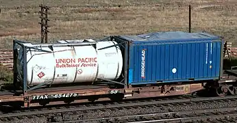 A spine car with a 20&nbsp;ft tanktainer and an open-top 20&nbsp;ft container with canvas cover