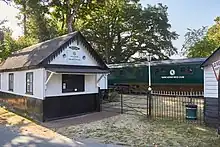 Photograph of a train carriage at a disused station