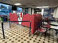 Photograph of the interior of a restaurant with seating