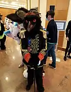 A realistic crow fursuiter.