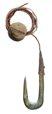 Stone fishing hook and sinker (a grooved pebble), used on the Jordan River during the Late Epipalaeolithic