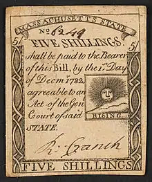A 1779 five-shilling note issued by Massachusetts with the inscription:  "FIVE SHILLINGS. shall be paid to the Bearer of this Bill, by the 1st Day of Decmr. 1782 agreeable to an Act of the Genl, Court of said STATE." ; Within print of sun: "RISING".