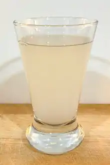 Photo of a glass misty coloured liquid