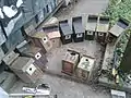 Repaired nestboxes for blue and great tits, unrepaired box at centre