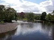River Wharfe, Ilkley from footbridge.mw-parser-output .geo-default,.mw-parser-output .geo-dms,.mw-parser-output .geo-dec{display:inline}.mw-parser-output .geo-nondefault,.mw-parser-output .geo-multi-punct{display:none}.mw-parser-output .longitude,.mw-parser-output .latitude{white-space:nowrap}53°55′56.94″N 1°48′56.43″W﻿ / ﻿53.9324833°N 1.8156750°W﻿ / 53.9324833; -1.8156750