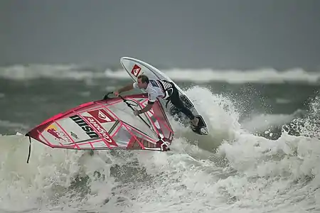 Image 16Robby NaishPhoto credit: Hoch ZweiAmerican windsurfer Robby Naish at the 2006 Windsurf World Cup, off the coast of Sylt, Germany. Naish was one of the first athletes to gain long-lasting international fame as a windsurfer. He won his first overall World Championship title, at the age of 13.More selected pictures