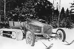 "Russo-Balt "C24-30" from the garage of Tsar Nicholas II with Kégresse track design of Adolphe Kégresse.  Adolphe Kégresse possibly seated on the right of the photograph