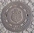 Manhole cover with the Oleśnica coat of arms