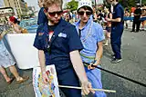 Shmaltz Brewing Company employees break into an impromptu air guitar solo on the Mermaid Parade route.