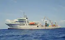 View of the ship at sea, from the left