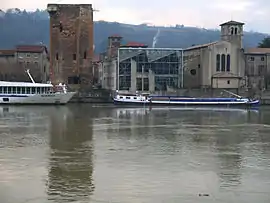 The tower and the church alongside the river