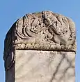 Enlarged view of the stele's reverse top-cap carvings