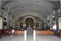 Well-lit nave of the Santa Cruz Church.
