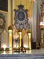 Processional banner of Our Lady of the Most Holy Rosary of La Naval. Below the Virgin's image are the arms of Vatican City, the arms of the Republic, and the arms of the Dominican Order.