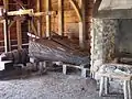 Reconstructed forge, interior view; note water-powered bellows.