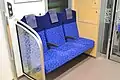 Three-person seating at the end of a car in March 2017