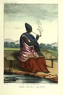 Image 10The Queen of Waalo - Lingeer Ndaté Yalla Mbodj (1810–1860) in her royal dress, seating and smoking a pipe.Credit: Llanta. Lithographer, Abbot P. David Boilat, author of text in his book Esquisses sénégalaises (1853). Source: cote : Gallica, bnf.fr - Réserve DT 549.2 B 67 M Atlas - planche n °5 - Notice n° : FRBNF38495418 - (Illustrations de Esquisses sénégalaises). Uploader to Wiki Commons   Patricia.fidiMore about Ndaté Yalla Mbodj...