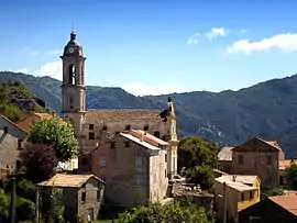 A view of the village and the parish church of the Annunciation, in Sermano