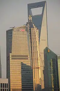 Next to the Jin Mao Tower.
