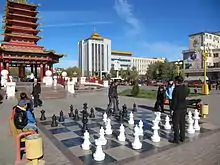 Playing chess near the Seven Days Pagoda, Elista