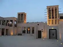 Image 31Sheikh Maktoum house courtyard featuring the common architecture of wind-catchers called Barjeel. (from Culture of the United Arab Emirates)