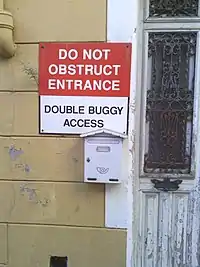 "DO NOT OBSTRUCT ENTRANCE. DOUBLE BUGGY ACCESS."
