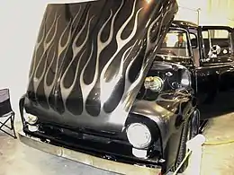 Fork flame job, a style introduced after 1975, on a '53–56 Ford F100