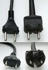 Moulded rubber Soviet plugs cut with knife so that they can fit into CEE 7/3 socket. Originally the plugs had a round base.