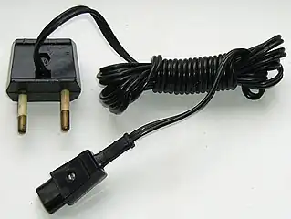 Soviet shaver power cord. The plug is similar to CEE7/16, but has different configuration. Thermoplastic plug is rated 6&nbsp;A and 250&nbsp;V.