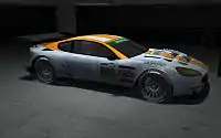 A racing car inside a garage.