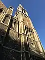 East face: spire and its tower, viewed aslant in Autumn sunlight