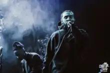 Gio Escobar (right) performing with Standing On The Corner in 2018.