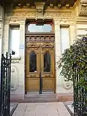 Wooden door with pediments of a 1896 house from Strasbourg (France). Even if it is Baroque Revival, it has many Neoclassical ornaments