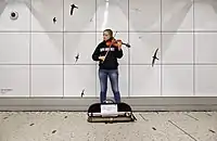 Violinist in the hallway connecting the train and metro portions of Brussels Central Station
