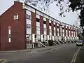 The 20th century version of the crescent terrace. Falconhurst in The Crescent, Surbiton, at the heart of Pooley's development.
