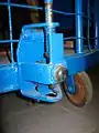 Front coupling pin and a caster