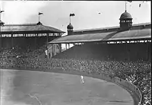 Black and white photo of the seating area of a single-tiered stadium