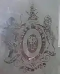 The Coat of Arms of Maharaja Gopal Lal Roy as depicted on a ground floor French Door window panel